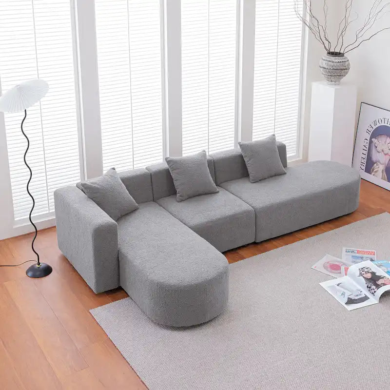 Canapé d'angle moderne en bouclette avec assise incurvée (orientée à gauche)