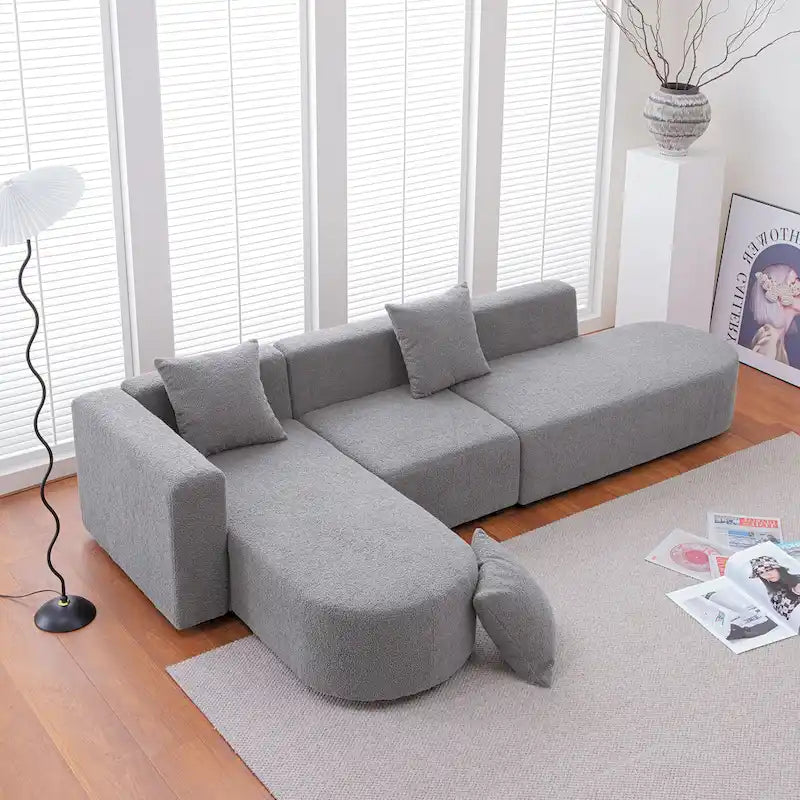 Canapé d'angle moderne en bouclette avec assise incurvée (orientée à gauche)