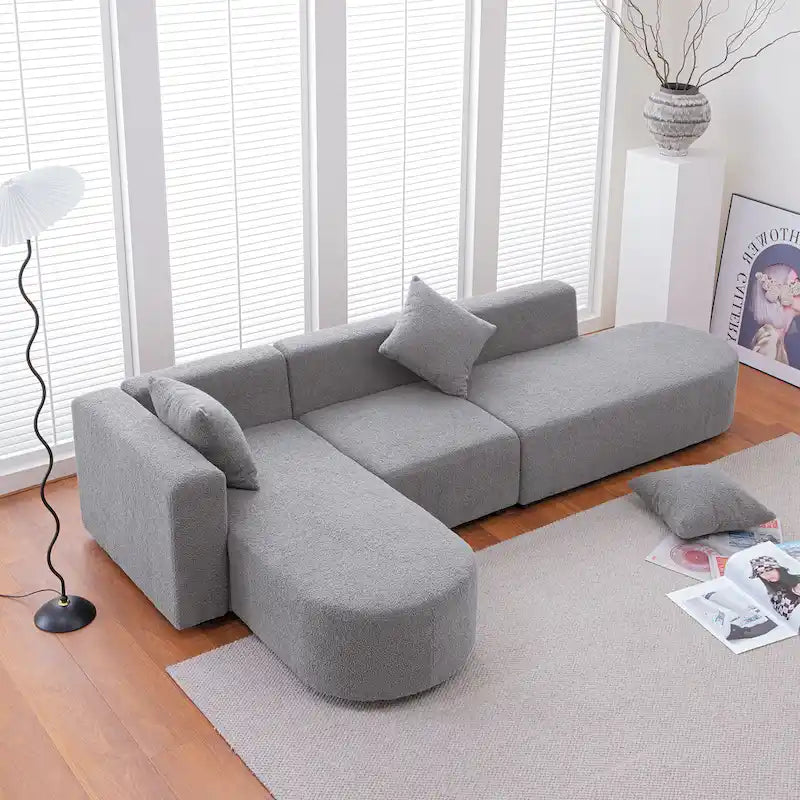 Canapé d'angle moderne en bouclette avec assise incurvée (orientée à gauche)