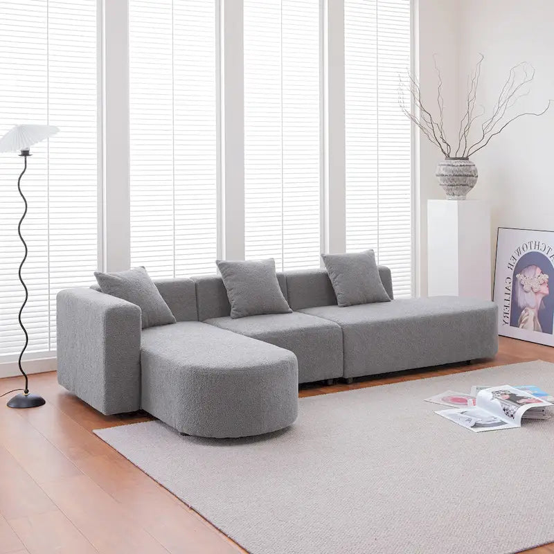 Canapé d'angle moderne en bouclette avec assise incurvée (orientée à gauche)