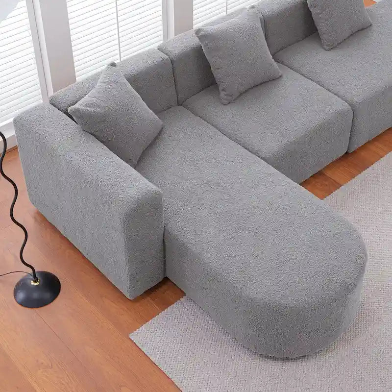Canapé d'angle moderne en bouclette avec assise incurvée (orientée à gauche)